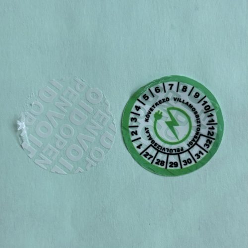 VOID nyomot hagyó 6 éves (2027-2032) villamosbiztonsági felülvizsgálati matrica, zöld/fekete nyomtatással, 30 mm kör, matt fehér