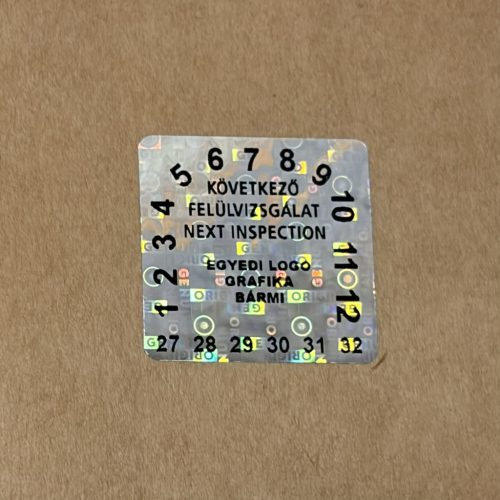 Original/Genuine 6 éves (2027-2032) kétnyelvű felülvizsgálati hologram matrica 30x30 mm 