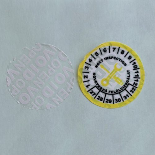VOID nyomot hagyó 6 éves (2027-2032) felülvizsgálati biztonsági matrica sárga/fekete nyomtatással, 30 mm kör, matt fehér