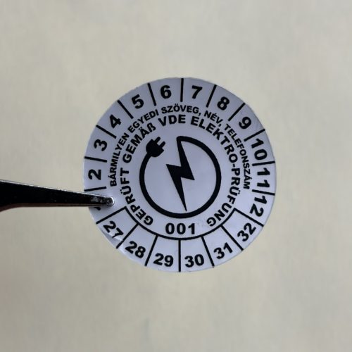 VOID nyomot hagyó 6 éves VDE (2027-2032) felülvizsgálati biztonsági matrica 30 mm kör, matt ezüst