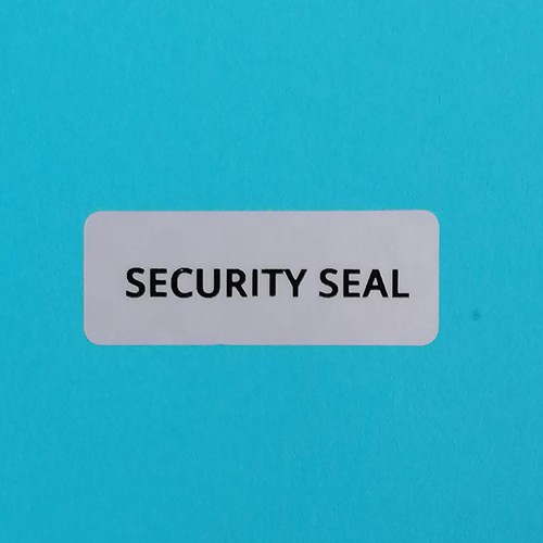 "SECURITY SEAL" pepita nyomot hagyó biztonsági matrica 40x15 mm, matt ezüst