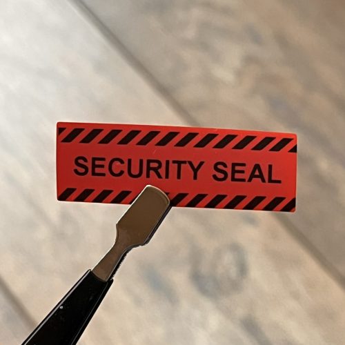 "SECURITY SEAL" NON VOID security label 45x15 mm, red