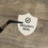 "SECURITY SEAL" VOID nyomot hagyó biztonsági matrica 25x30 mm pajzs forma, matt fehér