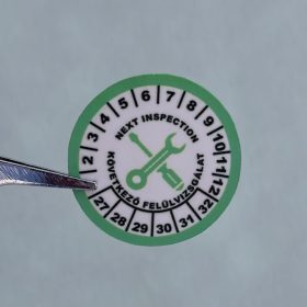   VOID nyomot hagyó 6 éves (2027-2032) felülvizsgálati biztonsági matrica zöld/fekete nyomtatással, 30 mm kör, matt fehér