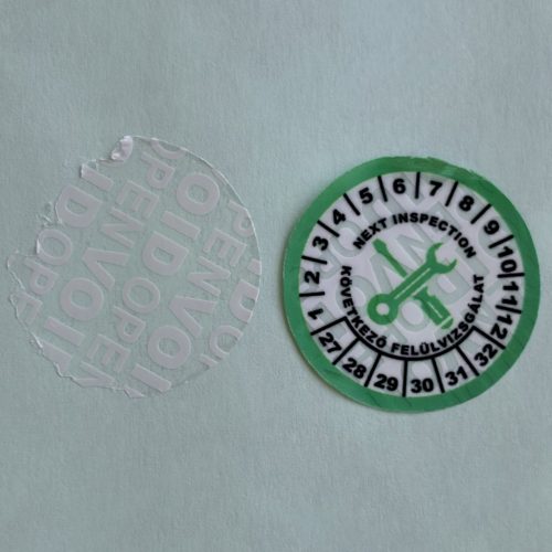 VOID nyomot hagyó 6 éves (2027-2032) felülvizsgálati biztonsági matrica zöld/fekete nyomtatással, 30 mm kör, matt fehér