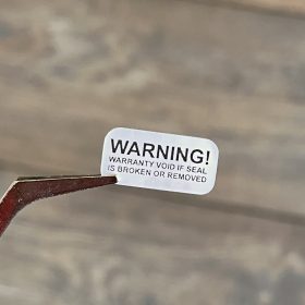   "WARNING" VOID nyomot hagyó biztonsági matrica 20x10 mm, matt ezüst