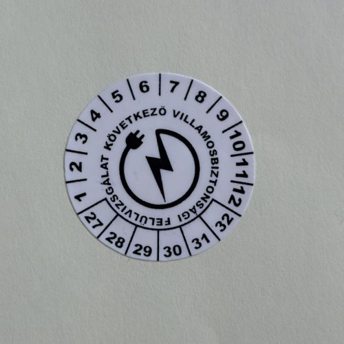 VOID nyomot hagyó 6 éves (2027-2032) villamosbiztonsági felülvizsgálati matrica, fekete nyomtatással, 30 mm kör, matt fehér
