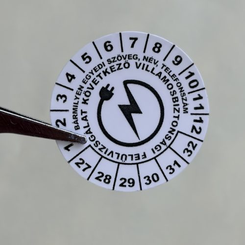 VOID nyomot hagyó 6 éves (2027-2032) villamosbiztonsági felülvizsgálati matrica, fekete nyomtatással, 30 mm kör, matt fehér