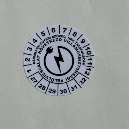 VOID nyomot hagyó 6 éves (2027-2032) villamosbiztonsági felülvizsgálati matrica, fekete nyomtatással, 30 mm kör, matt fehér